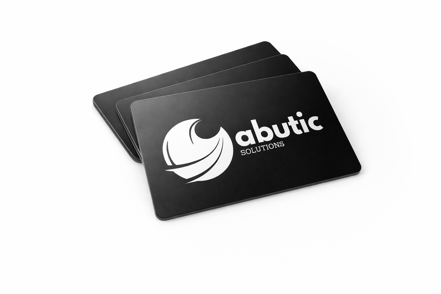 A stack of three black Abutic metal NFC business cards